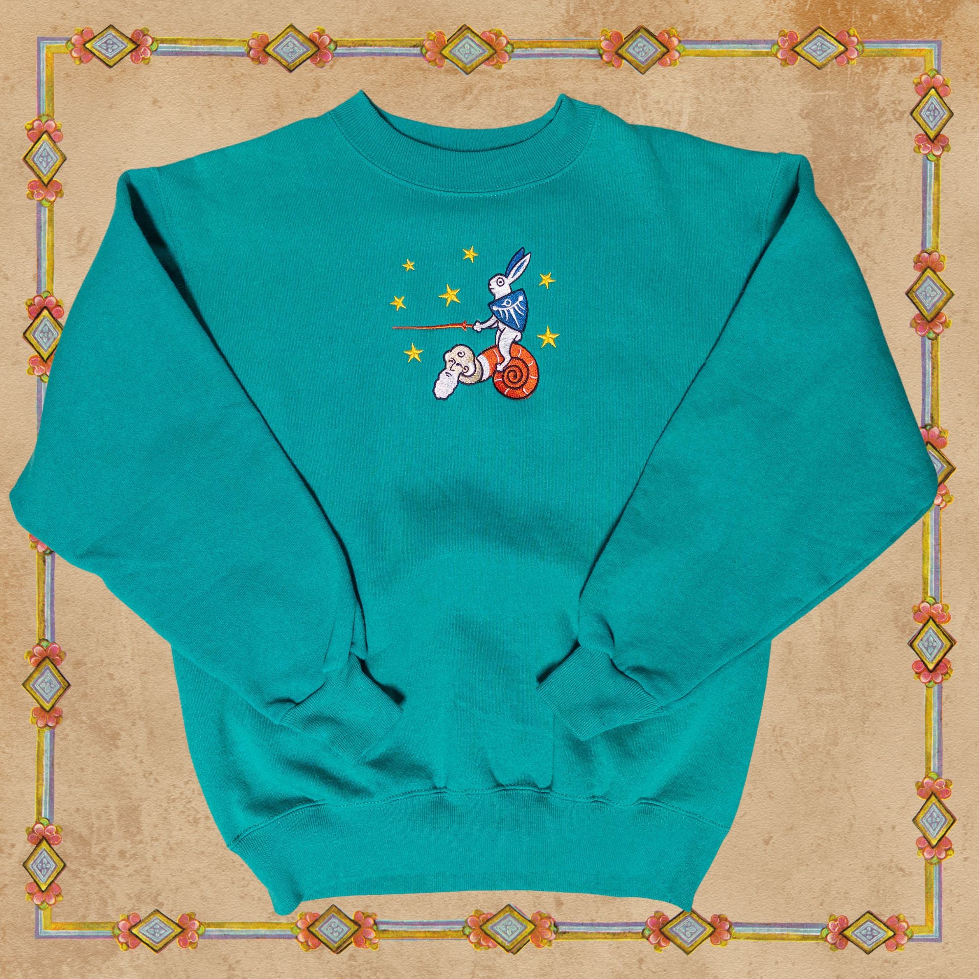Medieval Rabbit Riding Snail With Stars Sweater in Teal